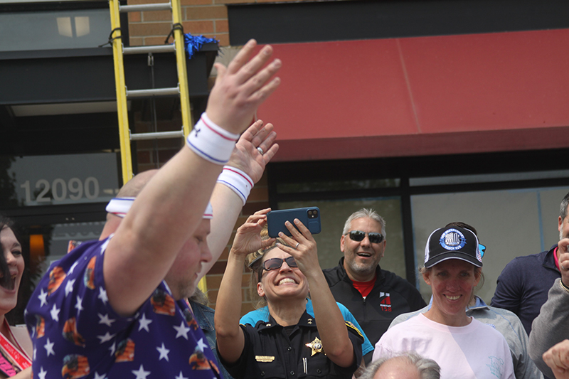 Huntley police officer Matthew Ganek won the doughnut eating contest at the “Cop on a Rooftop” fundraiser for Illinois Special Olympics Law Enforcement Torch Run May 19.