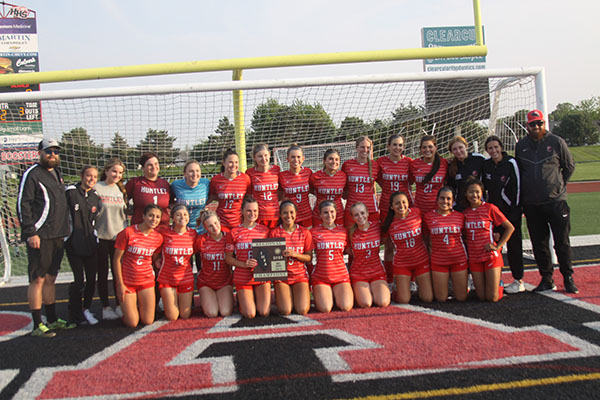 Huntley girls soccer team shows off the Class 3A Regional trophy it earned following a 5-0 win over DeKalb May 19.