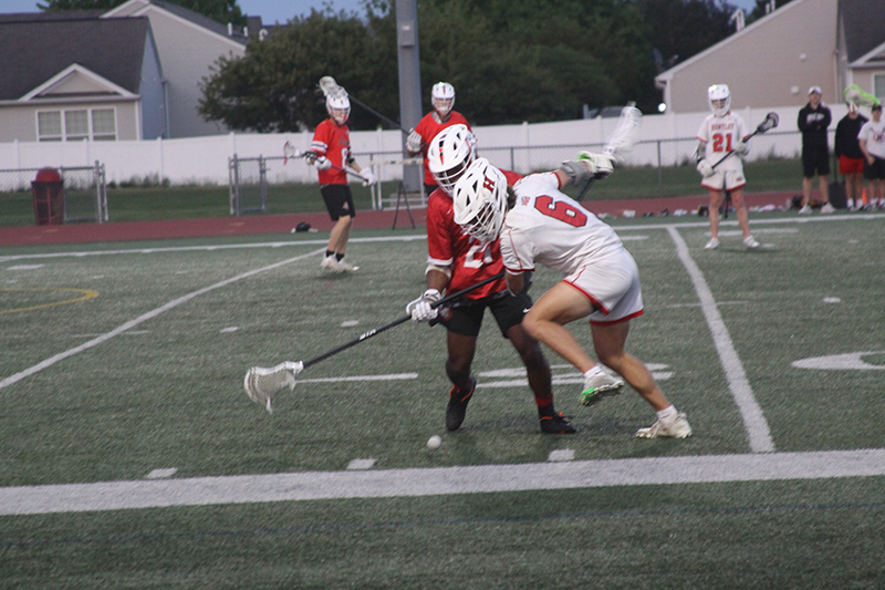 Huntley's Justin Jacobsen battles for control of the ball against Grant in the sectional opener.