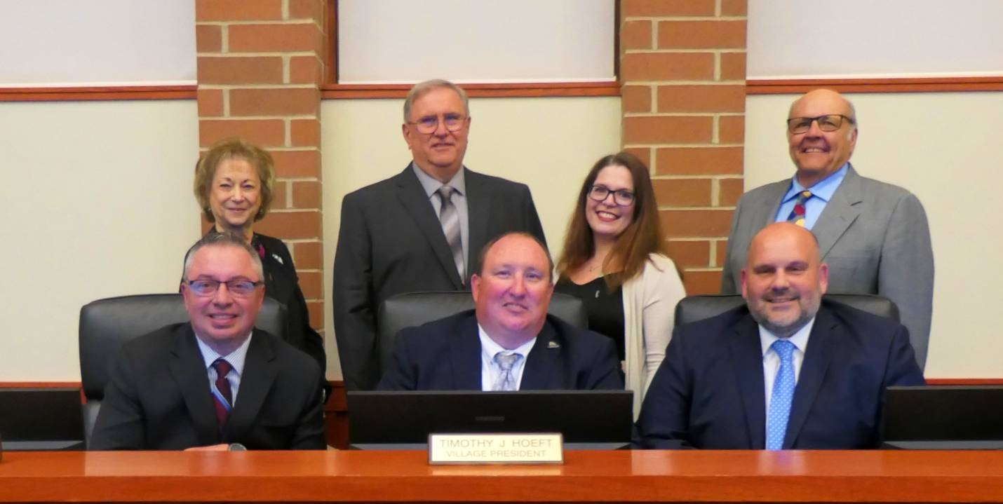 John Piwko (Upper Center), Vito Benigno (Far Upper Right), and Ric Zydorowicz (Far Lower Right) were sworn in as the new trustees at the May 11 Village Board meeting