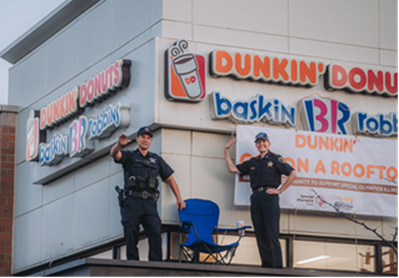 Huntley Police Officer Rich Miller, left and Deputy Chief Amy Williams were among officers who were 'Cops on a Rooftop' in 2022 at a Dunkin location in 2022 to benefit Illinois Special Olympics.