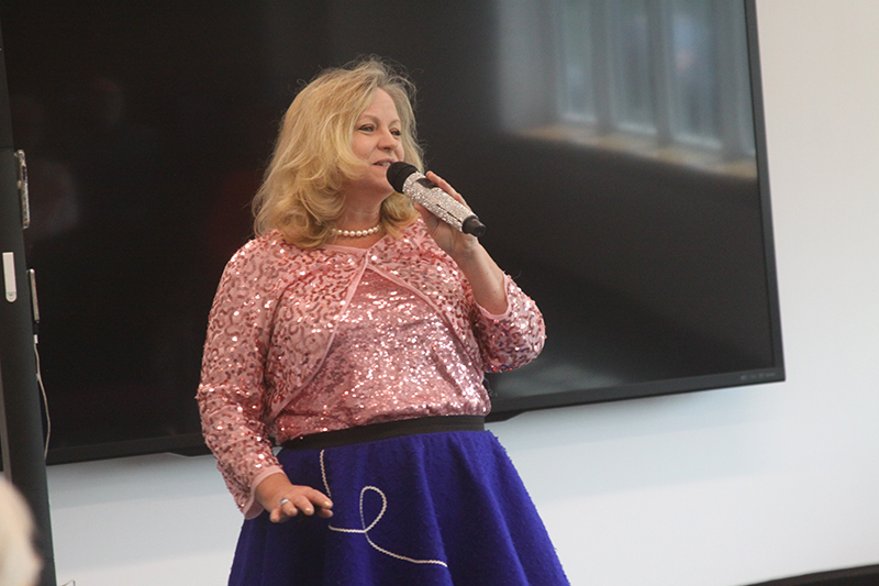 Heather Brauodakis sings 1950s songs at her Huntley Area Public Library program, “Fun, Fabulous Fifties” June 19.