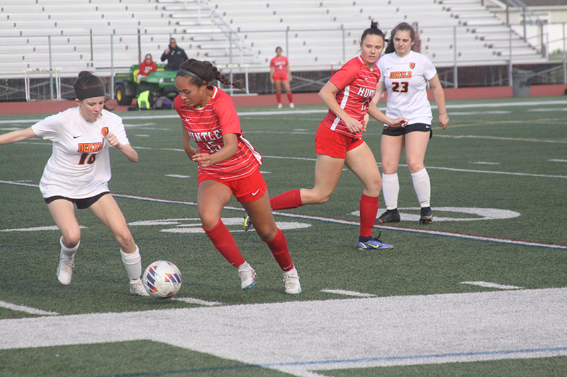 Huntley's Chloe Pfaff (15) battles against DeKalb at the regional final. Pfaff, a senior, earned all-state honors. Teammate Grace Helzer (6) looks on.