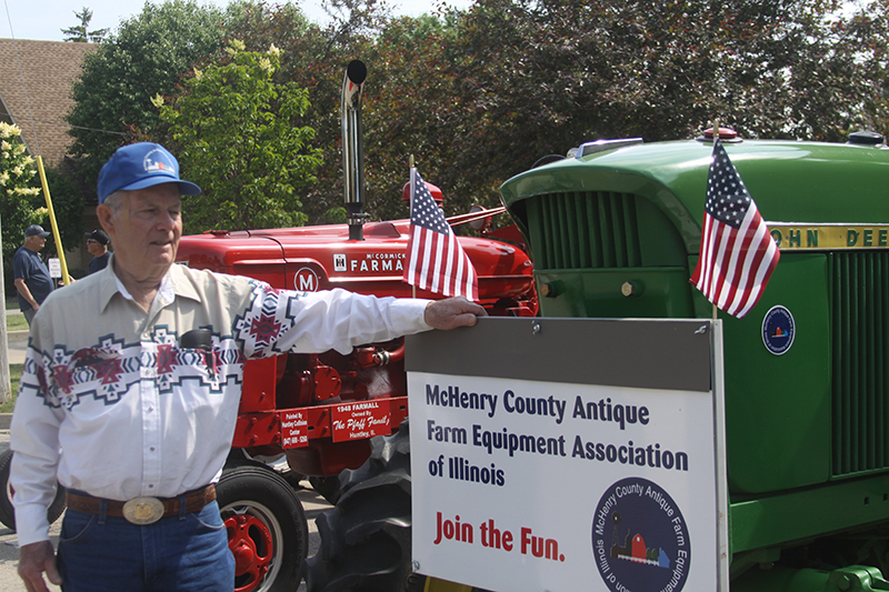 Jim Jones of the McHenry County Antique Farm Equipment Association, with a 1970 John Deere tractor.