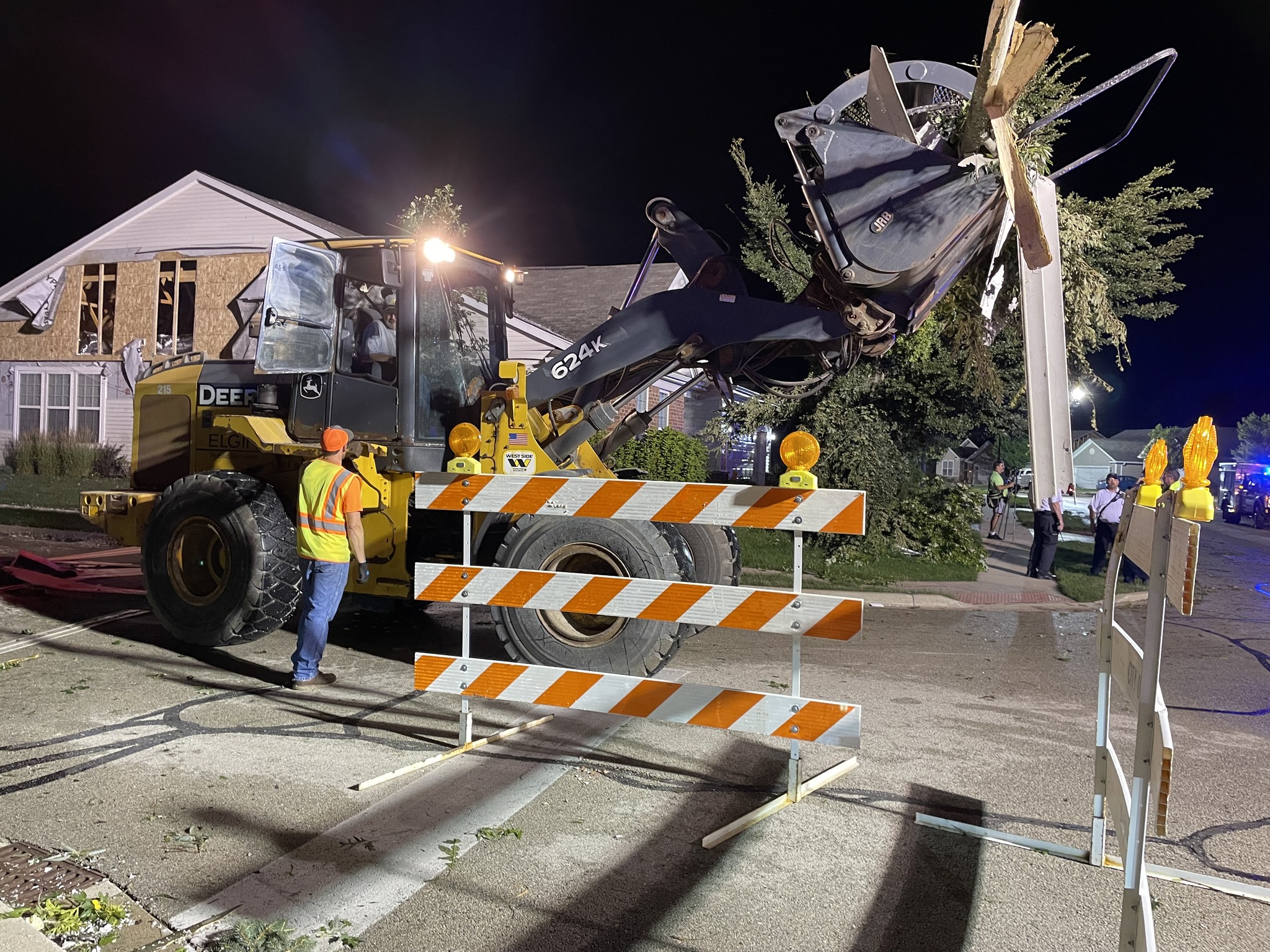 City of Elgin work crews worked throughout the night to remove storm debris from roadways and driveways after a tornado touched down in Elgin