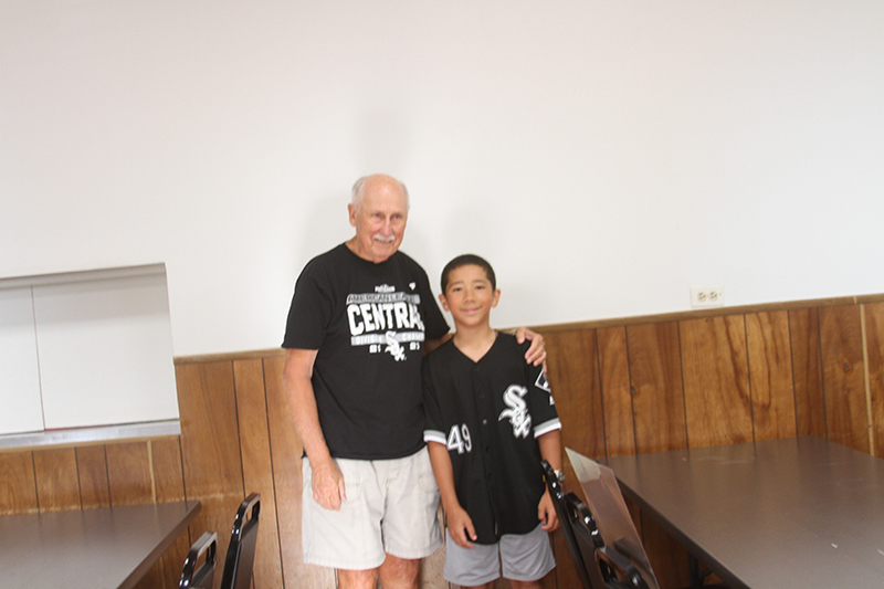 Chicago White Sox Fan Club members Glenn Groebli, left and Adrien Hernandez, age 12, attended a club meeting July 31.