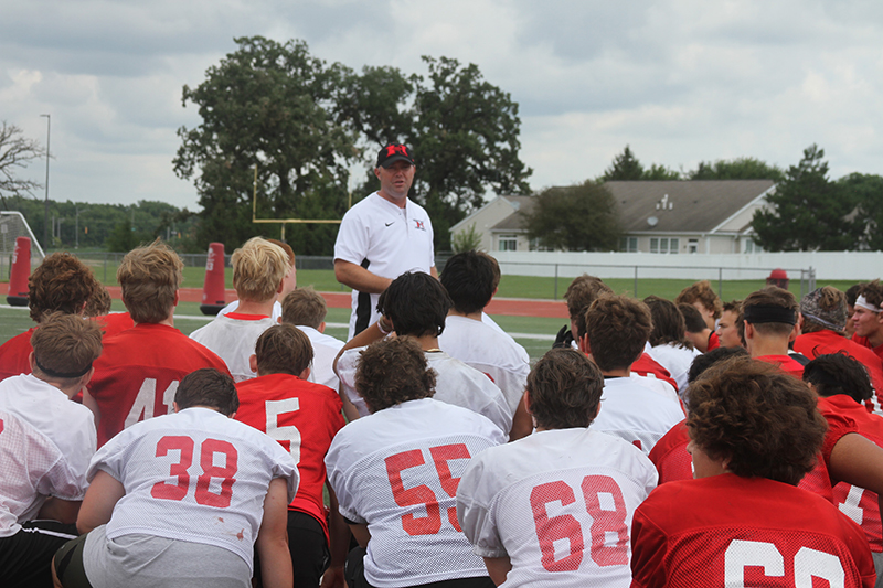 Huntley head football coach Mike Naymola speaks to the team after a practice. The Red Raiders host Crystal Lake Central at 7 p.m., Aug. 25 in the season opener.