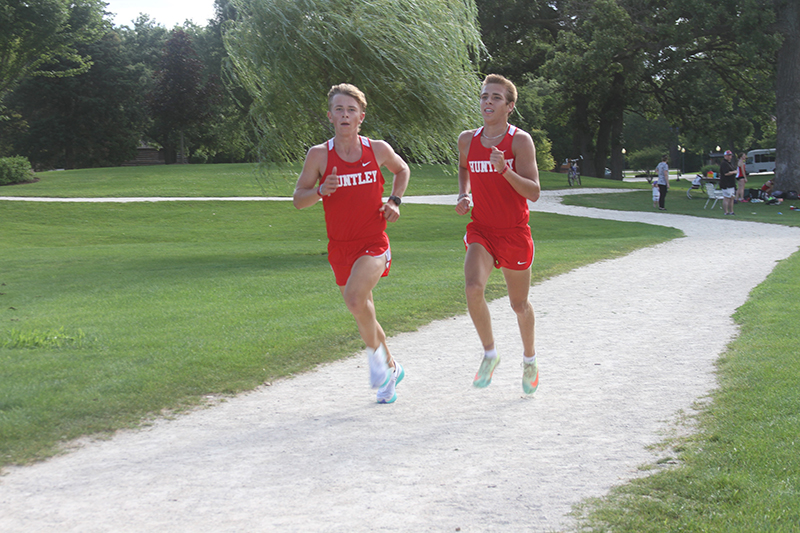 Huntley boys cross country runners Zach Zuzzio, left and Tommy Nitz are among the returning players for the Red Raiders this fall. They participate in a practice held at Deicke Park.