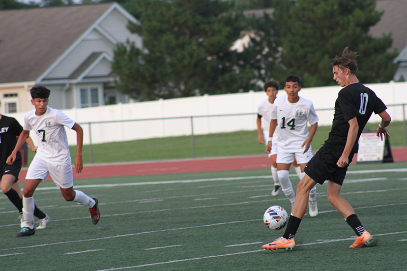 Huntley senior Hudson Nielsen looks to pass the ball to a teammate. The Red Raiders were 1-0-1 in their first two matches.