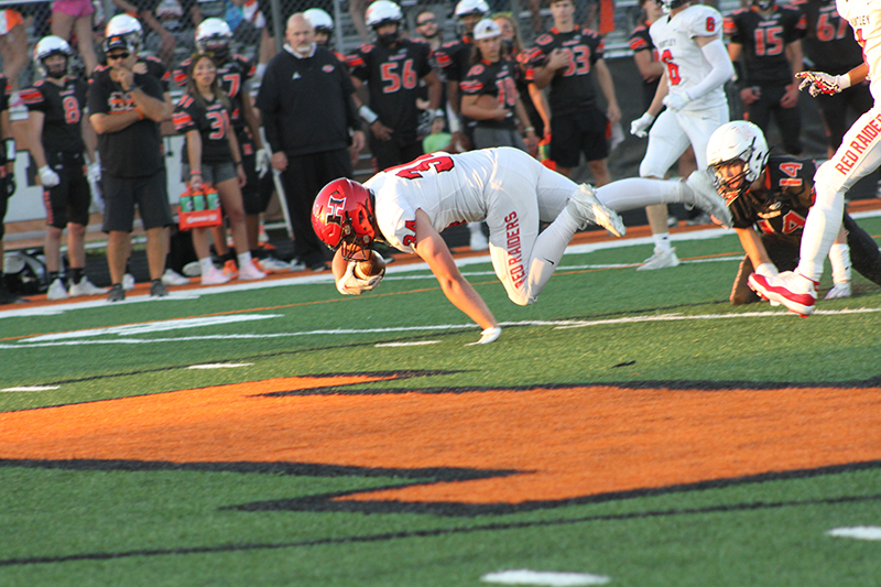 Huntley senior running back Haiden Janke dives for more yardage in a 122-yard night. He had three touchdowns scores in a 35-6 win against McHenry.