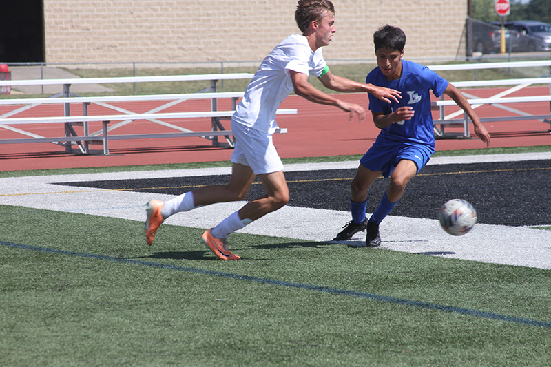 Huntley senior Hudson Nielsen battles against Elgin Larkin. He is the Red Raiders' leading goal scorer.