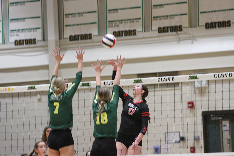 Huntley junior Georgia Watson battles at the net against Crystal Lake South.