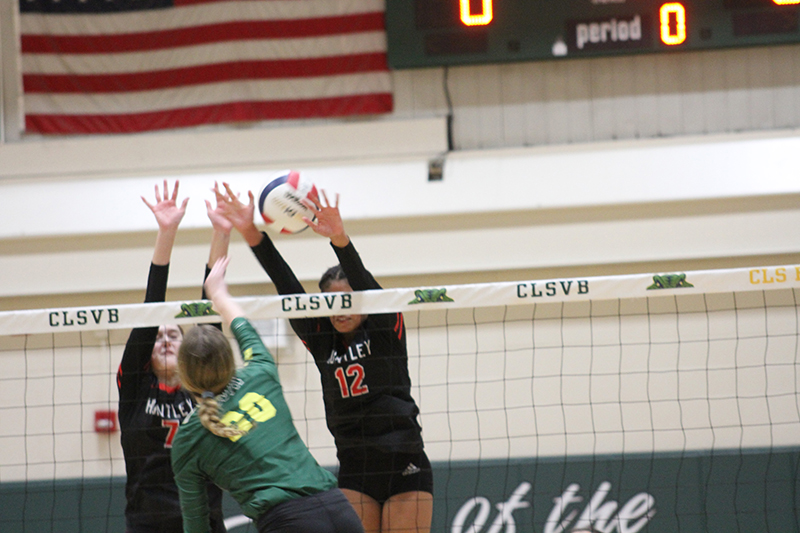 Huntley's Jocelyn Ehrling and Morgan Jones battle at the net. The Red Raiders were 9-0, 8-0 Fox Valley Conference.