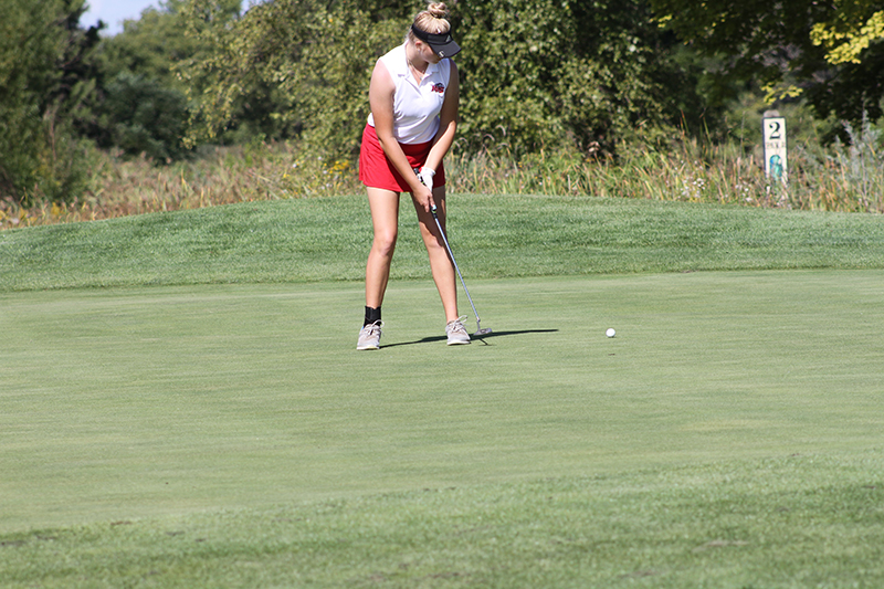 Huntley golfer Maddie Sloan putts during the Anne Christensen McHenry County girls golf tournament.