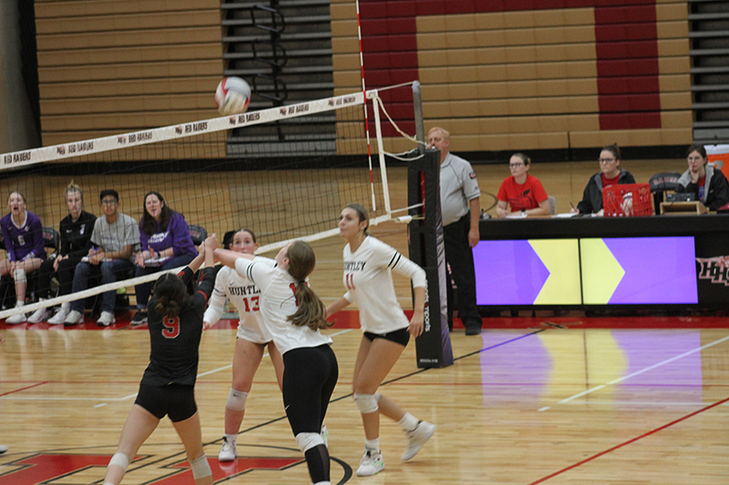 Huntley volleyball players from left, Mari Rodriquez, Lizzy Williams, Laura Boberg and Avery Gonzalez are on the attack against Hampshire.