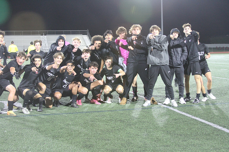 Huntley's boys soccer team celebrates its co-Fox Valley Conference championship.