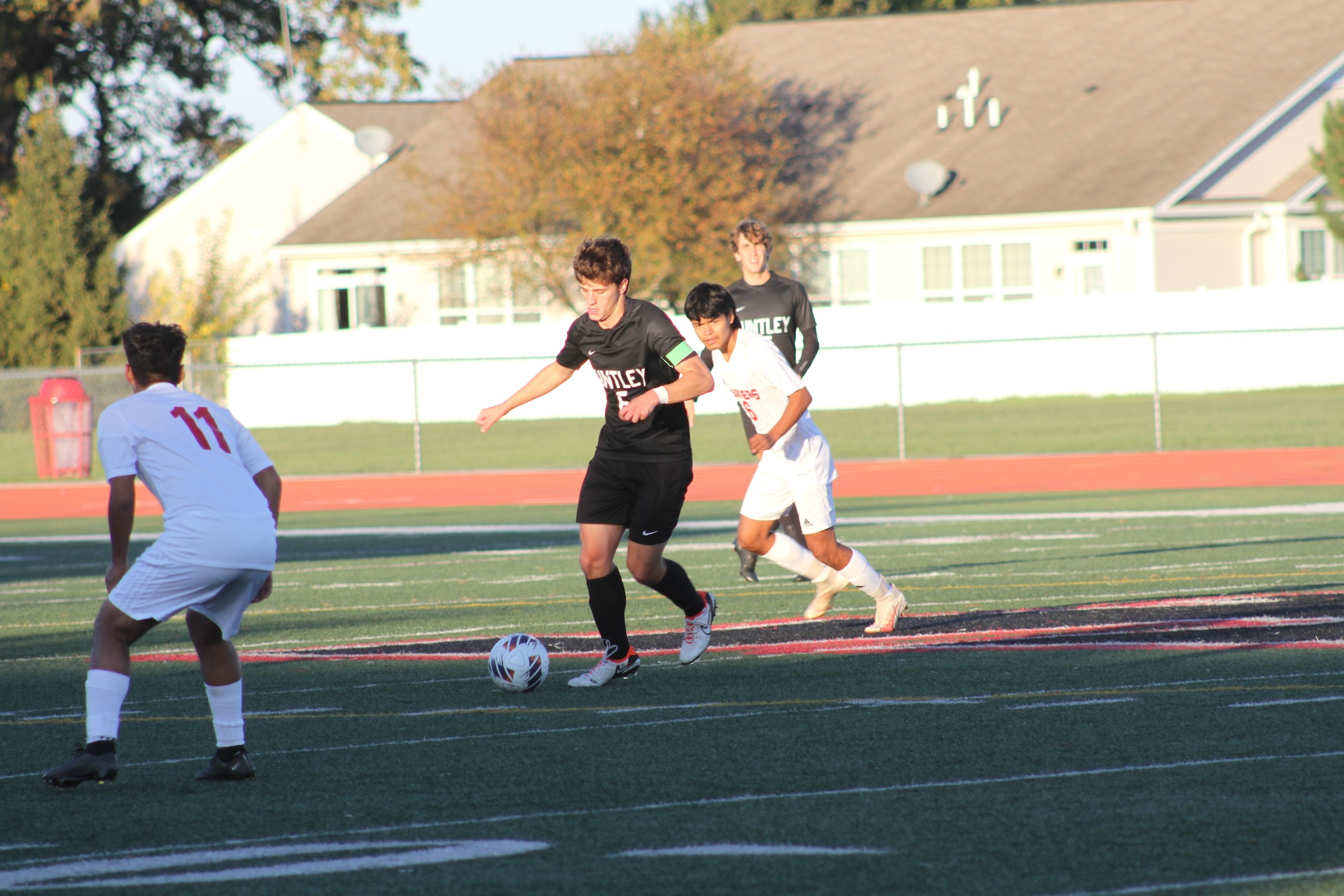 Huntley senior Jack Breunig battles Dundee-Crown players at the Huntley Class 3A Regional Championship. The Red Raiders, face Elgin at the Round Lake Sectional semifinal Oct. 24.