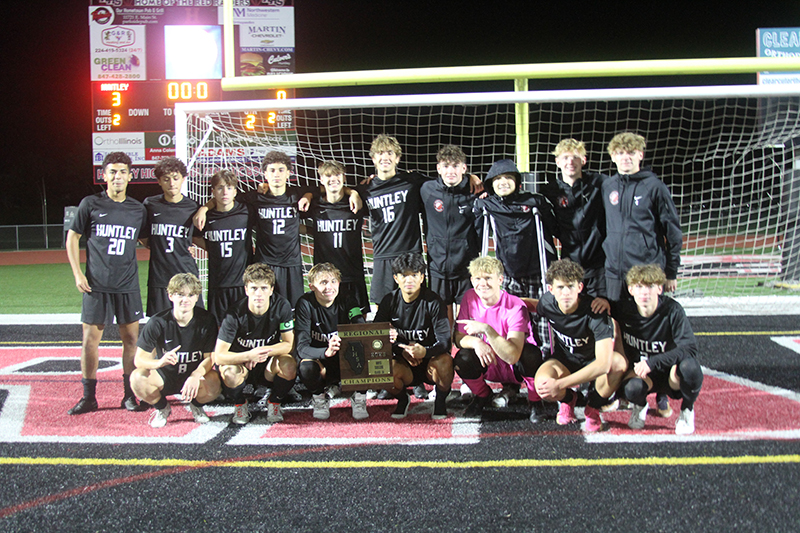 Huntley boys soccer team poses after receiving the Class 3A HHS Regional championship plaque won over Dundee-Crown Oct. 20.