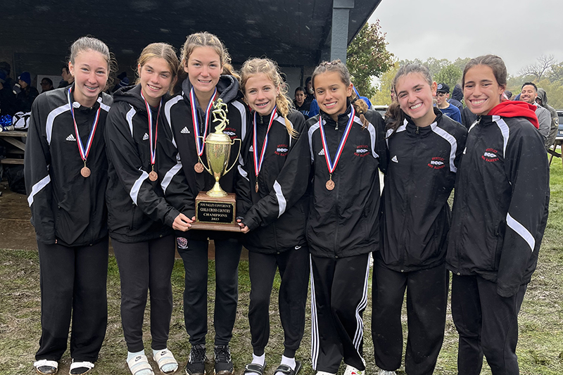 The Huntley girls cross country squad celebrates its Fox Valley Conference championship Oct. 14. From left to right: Morgan Sauber, Aspen Maldonado, Ava Allison, Cori Kilvinger, Haley Rahman, Ava Berardi and Mackenzie Billard.