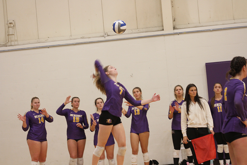 Former Huntley volleyball standout Emily Willis concentrates as she serves for McHenry County College's team.