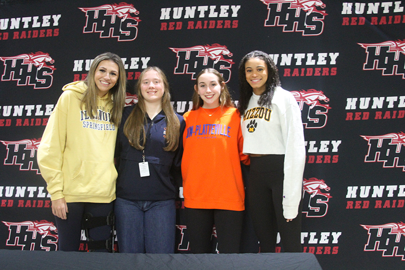 Huntley volleyball seniors pose at the Red Raiders Fall Signing Day ceremony Nov. 8. Players who signed their National Letters of Intent are, from left: Avery Gonzalez, Lizzy Williams, Laura Boberg and Morgan Jones.