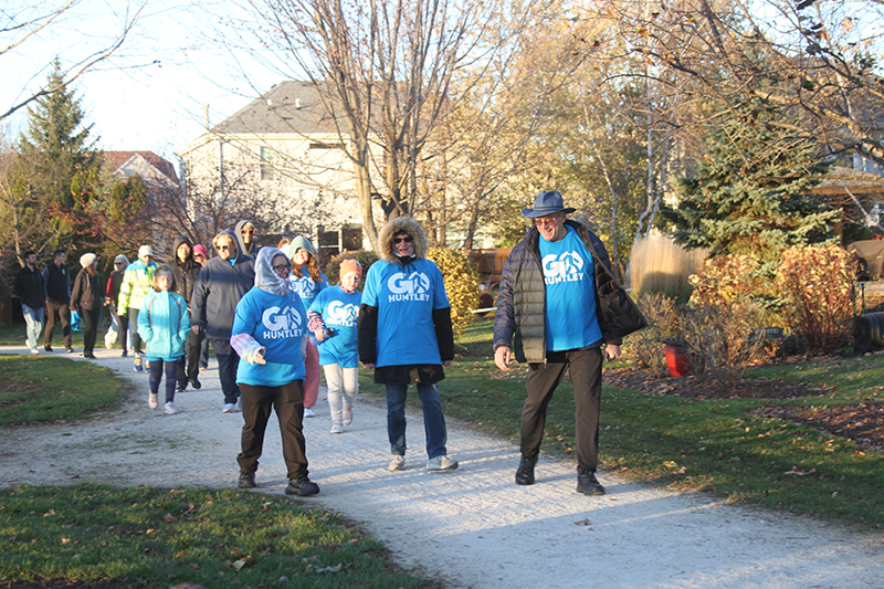 Participants enjoy the Go Huntley Walking Club walk at Parisek Park Nov. 9.