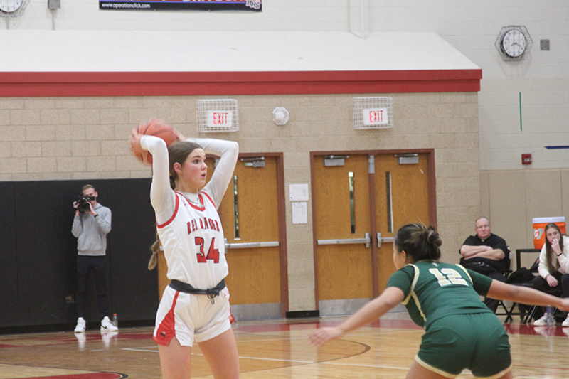 Huntley junior Ava McFadden looks to pass the ball during the season opener against Boylan Catholic Nov. 14.