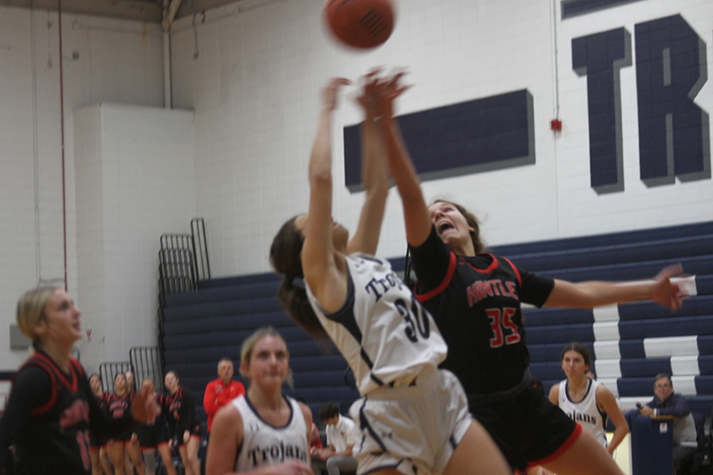 Huntley junior Paula Strzelecki, right, battles a Cary-Grove player for a rebound in a HHS win Nov. 28.