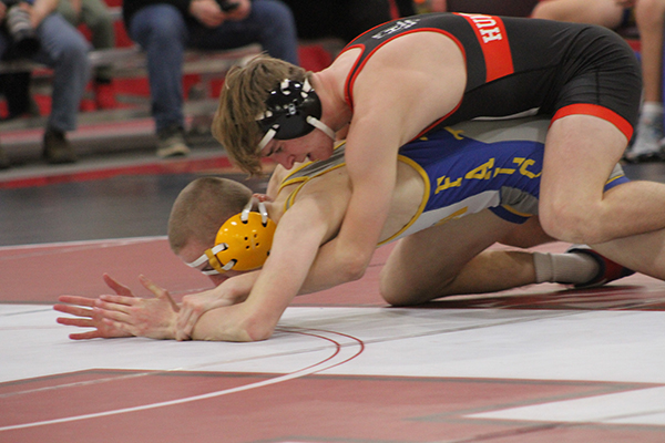 Huntley wrestler Shane McGuine battles a Wheaton North opponent. He competes at 150 pounds.