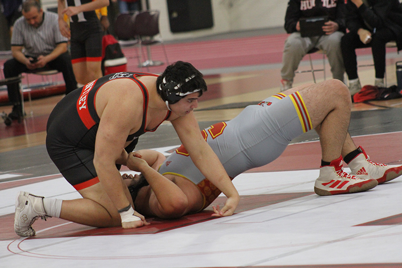 Huntley 285-pound wrestler Markos Mihalouplos works for a win against a Schaumburg opponent.