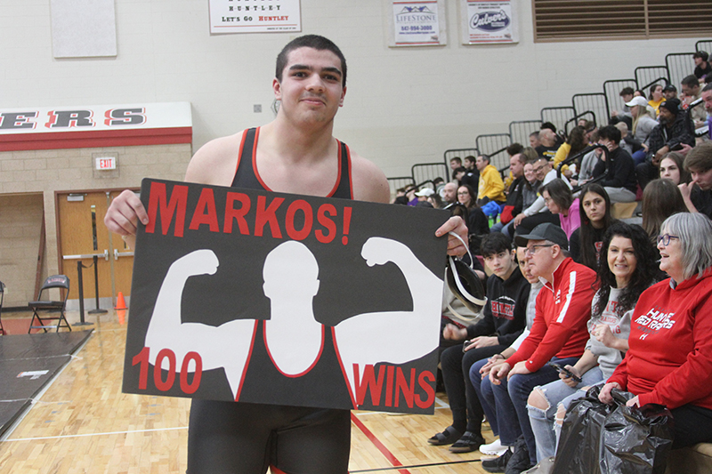 Huntley's Markos Mihalopoulos celebrates his 100th career win at the Red Raiders hosted IHSA Regional wrestling meet Feb. 3. He won his weight class and advanced to the IHSA Sectional at Barrington Feb. 9-10.