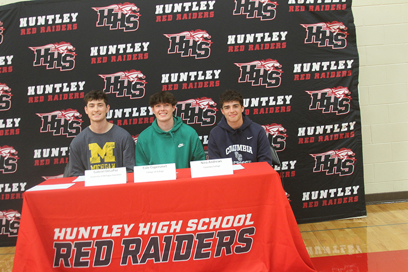 Three Huntley senior boys lacrosse players inked their letters of intent to continue their lacrosse careers this fall. They are, from left, Gabe De La Pex, who chose University of Michigan-Dearborn; Cole Copersmet, College of DuPage and Nico Andrews, Columbia (MO) College.