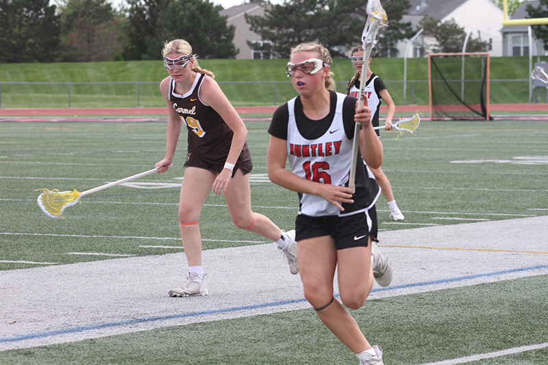 Huntley junior girls lacrosse player Katie Ferrara is on the attack against Carmel May 4.