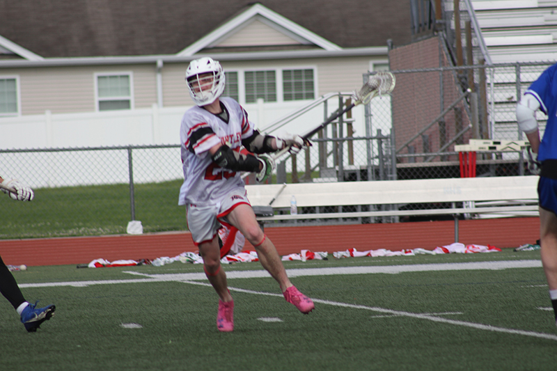 Huntley's Bobby Pupich takes aim at the goal against St. Charles North. The Red Raiders won their IHSA Sectional match 14-5.