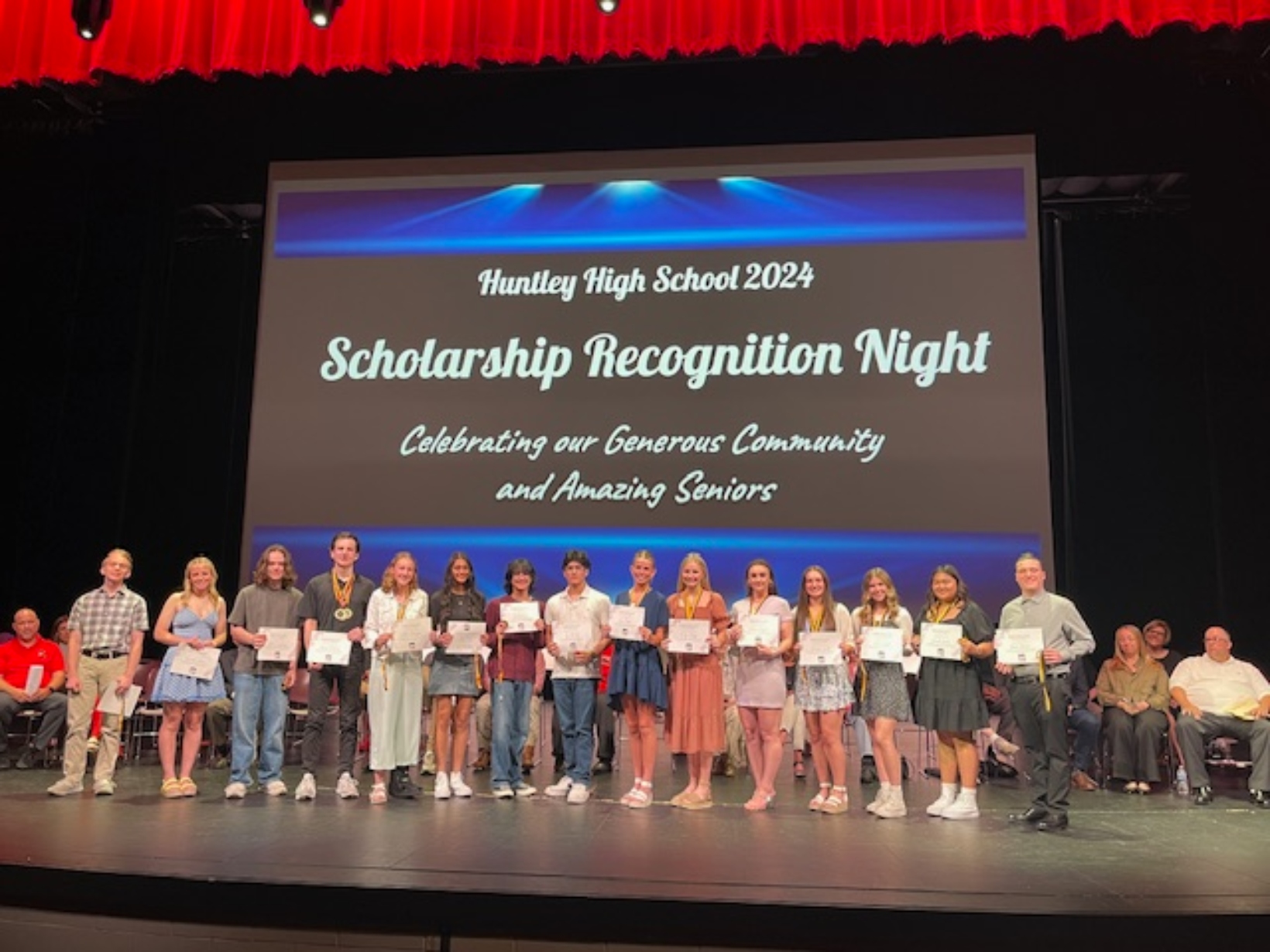 2024 winners of the D158 Education Foundation scholarships accept their award at the foundation Scholarship Recognition Night