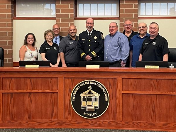 Huntley Police Chief Rober Porter (Center) will be retiring on June 7 after serving the village since 2015