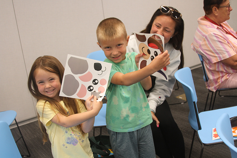 The John family enjoys working on an art project as part of the kickoff to Huntley District 158's summer reading program June 10 at Huntley Area Public Library. D158 Superintendent Dr. Jessica Lombard, read a chapter of “Charotte's Web”. From left: Sully John, Caroline John and Kayley John