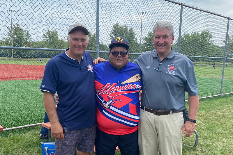 McHenry County Youth Sports Association (MCYSA) officials Dan Malone, executive tournament director; Luis Alvardo of Maceteros baseball of Puerto Rico and John Streit, MCYSA president, pose at an earlier international championship tournament.