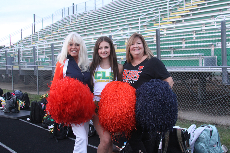 Former Chicago Honey Bears cheerleaders Patti Gramarossa, left, Crystal Lake South cheerleader Mackenzie Kirkpatrick and former Honey Bear Lynnann Holdapfel.