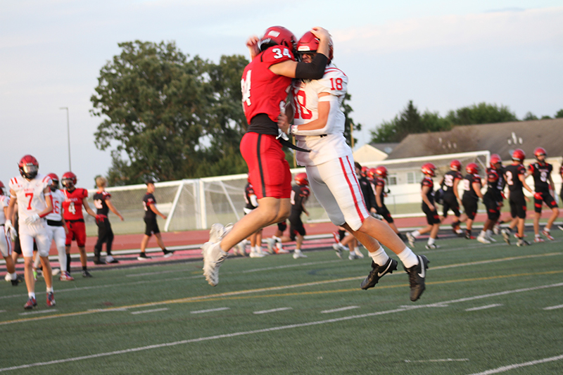 Huntley seniors Grant Tucker, left and Colin Hochmuth before the start of the Red Raiders Fall Kickoff scrimmage Aug. 24.