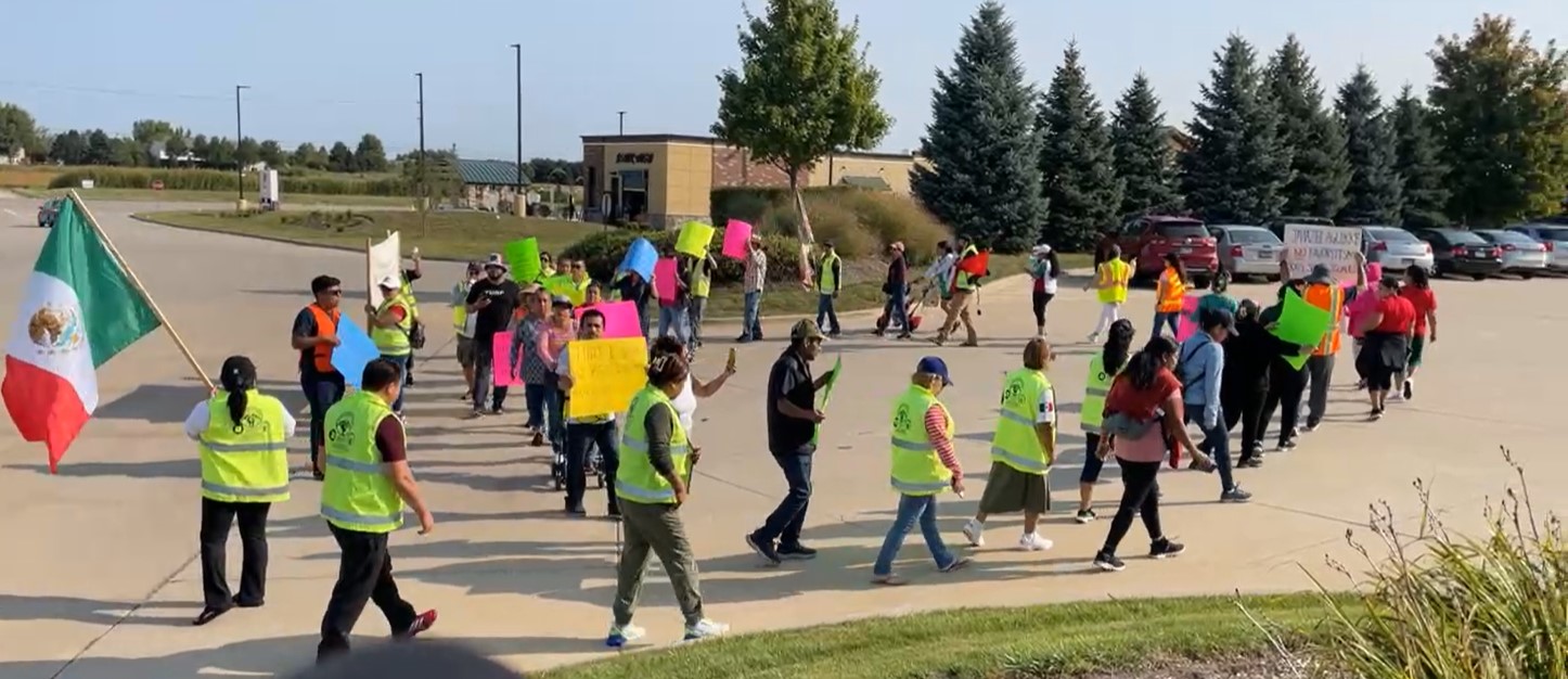 Former employees of TURF Design, Inc. protest in front of the company on Sept. 11