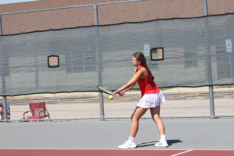 Huntley's Shea Nagle serves in a tennis match at the Red Raiders quad meet Sept. 14.