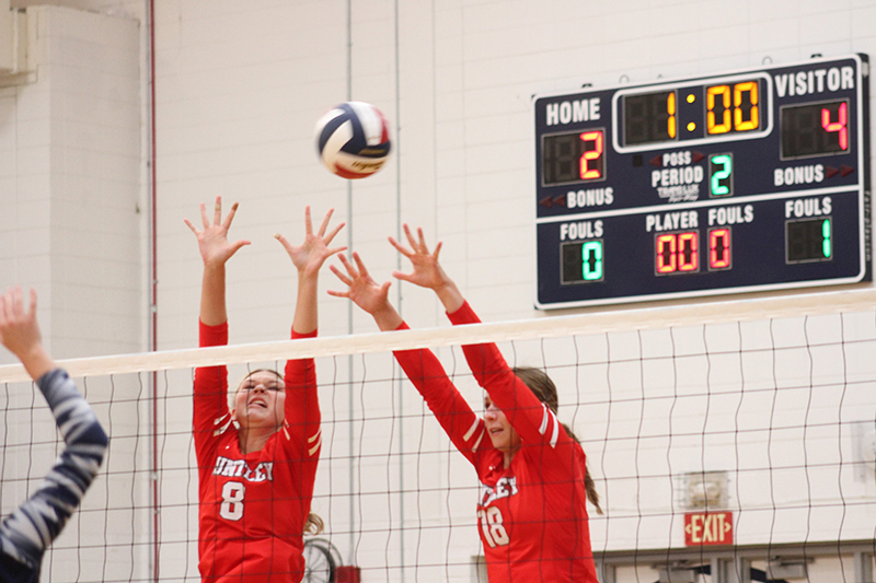 Huntley's Summer Massow, left and Sienna Robertson battle at the net in a win over Cary-Grove.