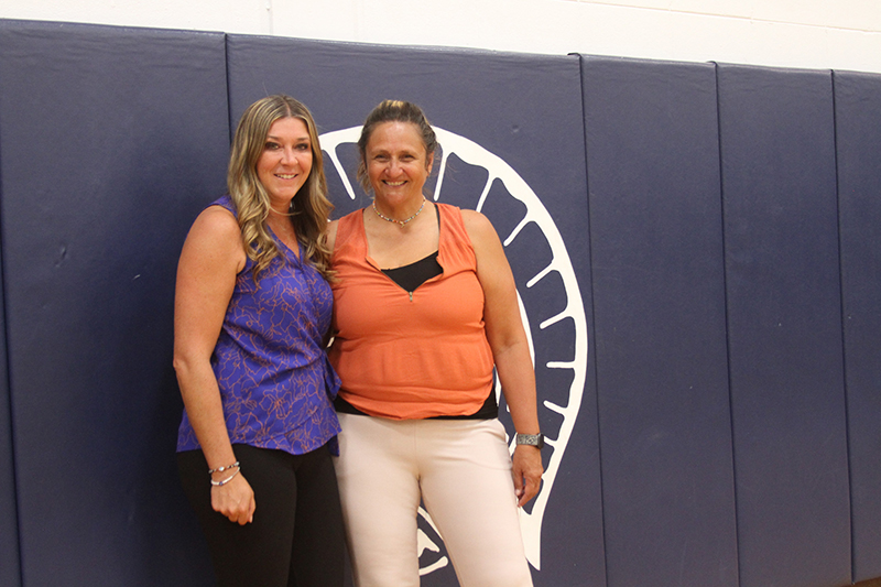 Huntley head volleyball coach Karen Naymola, left and her high school mentor, Cary-Grove head coach Patty Langanis.