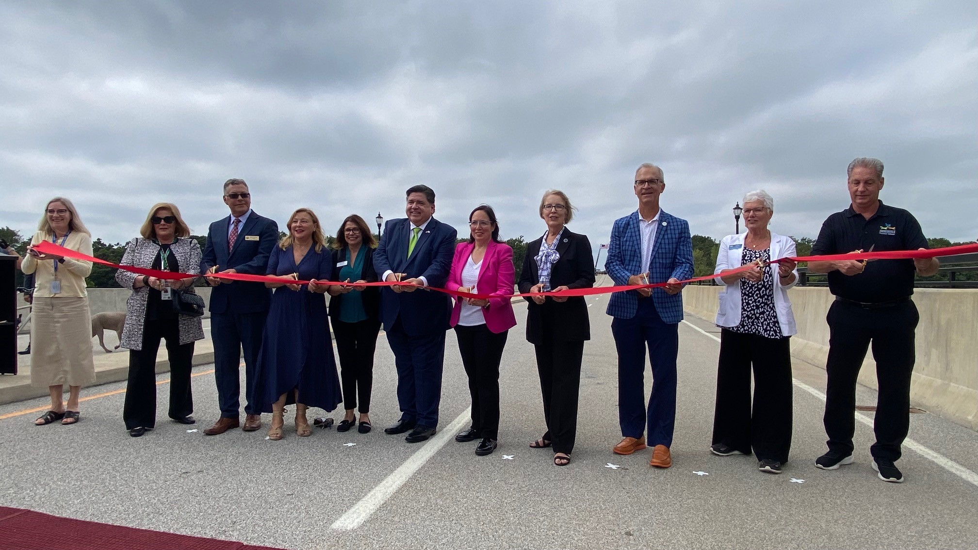 Several Illinois government officials participated in the ribbon-cutting ceremony to debut the long-awaited opening of the Longmeadow Parkway Bridge