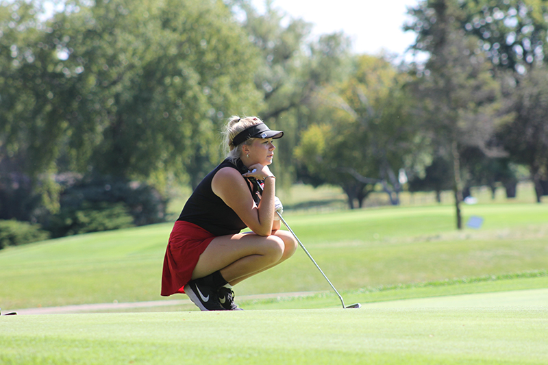 Huntley senior golfer Maddie Sloan concentrates before a putt at the IHSA Class 2A Girls Golf Regional meet at Pinecrest Golf Club.