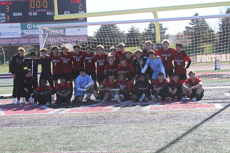 The Huntley boys soccer team celebrates its IHSA Class 3A regional championship.