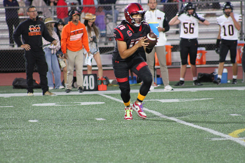 Huntley senior quarterback Braylon Bower starts a play Sept. 6 against McHenry.