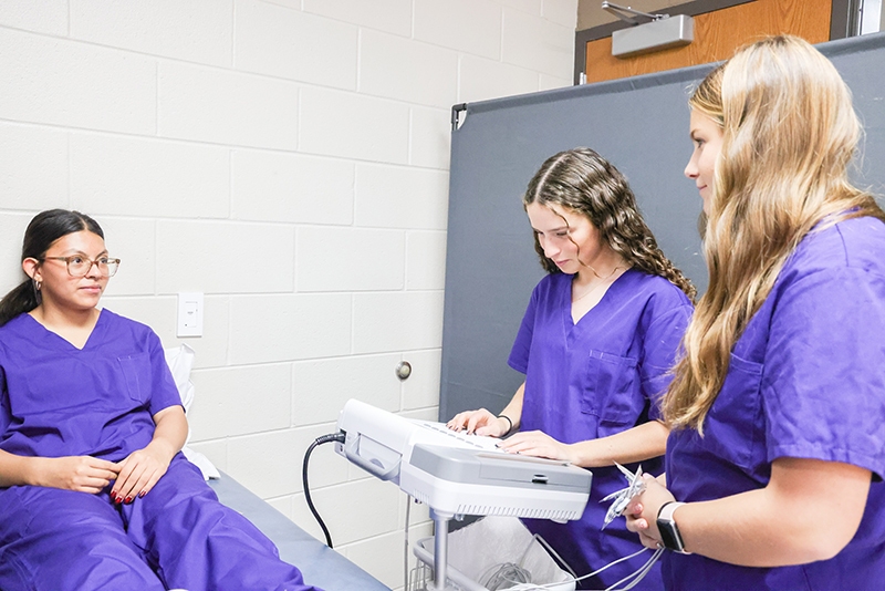 From Left to Right-HHS Juniors Sophia Aguila, Lauren Goers, and Rylie Garrett take the EKG certification course through an MCC and HHS partnership