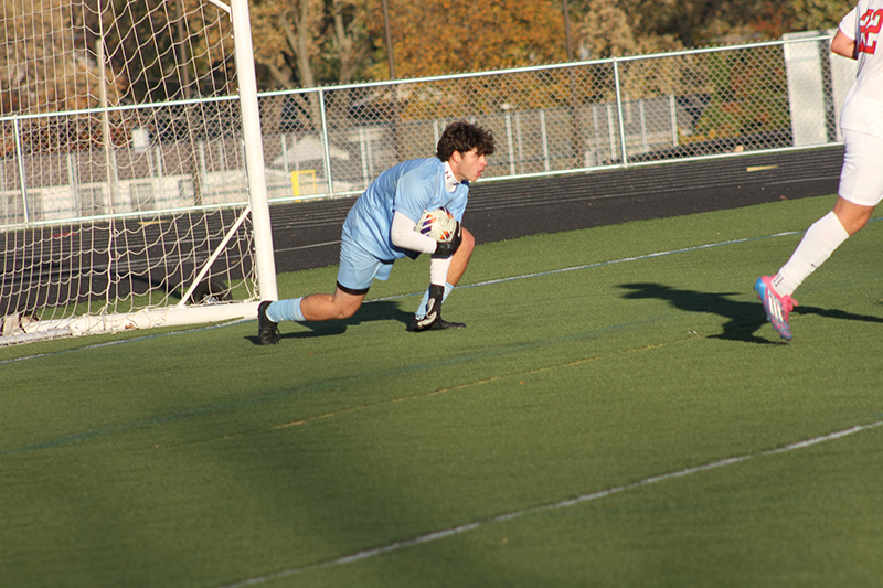 Huntley senior goalie Jeremiah Reynolds makes a save in the Streamwood Class 3A Sectional Final battle with Elgin.